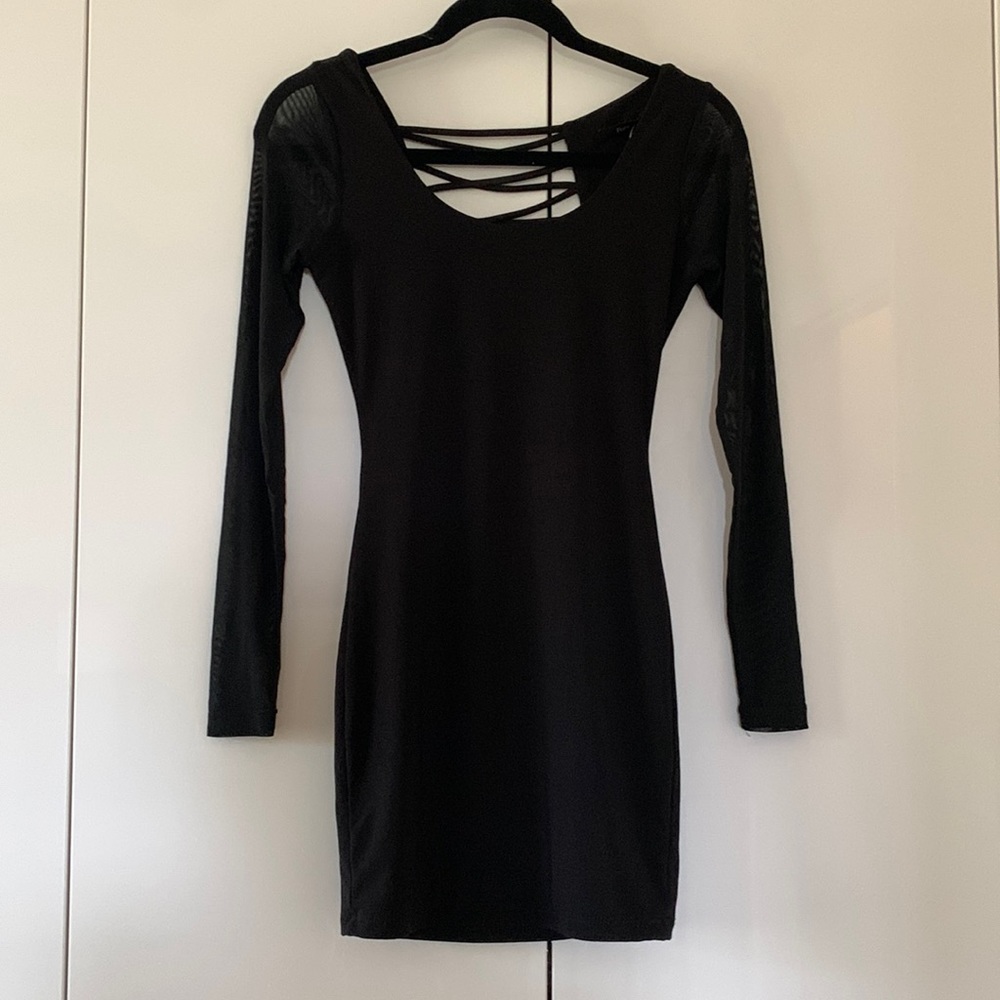 Black mini dress, long sleeves with mesh, open back